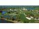 Aerial view of lush golf course community near the water at 393 N Point Rd # 503, Osprey, FL 34229