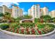 Landscaped entrance to Meridian condos with signage at 393 N Point Rd # 503, Osprey, FL 34229
