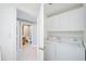 Laundry room with washer, dryer, and access to bathroom at 393 N Point Rd # 503, Osprey, FL 34229