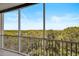 Serene balcony view overlooking water and trees at 393 N Point Rd # 503, Osprey, FL 34229