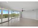 Spacious living room with tile floors and access to balcony at 393 N Point Rd # 503, Osprey, FL 34229