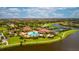 Resort-style pool, tennis, pickleball courts, and clubhouse at 12656 Felice Dr, Venice, FL 34293