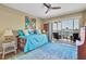 Bright bedroom with a daybed, balcony access, and a ceiling fan at 1714 69Th W Ave # B205, Bradenton, FL 34207