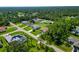 Aerial view of residential neighborhood with houses and lush greenery at 5494 Mojave Ave, North Port, FL 34288