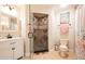 Bathroom with shower, toilet, vanity and decorative tile at 213 75Th St, Holmes Beach, FL 34217
