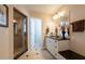 Elegant bathroom with a large walk-in shower, double vanity, and granite countertop at 213 75Th St, Holmes Beach, FL 34217