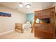 Bedroom with twin bed and bunk bed, light wood flooring, and beach-themed decor at 213 75Th St, Holmes Beach, FL 34217
