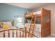 Bedroom featuring twin bed and bunk bed, light wood floors, and coastal decor at 213 75Th St, Holmes Beach, FL 34217