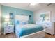 Guest bedroom with a full-size bed and white dresser at 213 75Th St, Holmes Beach, FL 34217