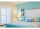 Bright bedroom with a queen-size bed and coastal decor at 213 75Th St, Holmes Beach, FL 34217