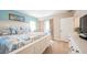 Main bedroom with king bed, light wood furniture, and access to patio at 213 75Th St, Holmes Beach, FL 34217