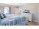 Bedroom with a queen-size bed, dresser, and a TV at 213 75Th St, Holmes Beach, FL 34217