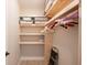 Walk-in closet with wooden shelves and ample hanging space at 213 75Th St, Holmes Beach, FL 34217