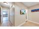 Hallway with view into kitchen and access to bedroom and bathroom at 213 75Th St, Holmes Beach, FL 34217