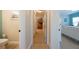 Hallway with light flooring, leading to bedrooms and a bathroom at 213 75Th St, Holmes Beach, FL 34217