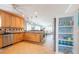 Bright kitchen with light wood cabinets, stainless steel appliances, and tile flooring at 213 75Th St, Holmes Beach, FL 34217