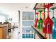 Close-up view of a kitchen shelf with colorful glasses and decorative items at 213 75Th St, Holmes Beach, FL 34217