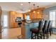 Kitchen with light wood cabinets and granite countertops at 213 75Th St, Holmes Beach, FL 34217