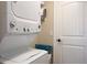 Stackable washer and dryer in a small laundry room at 213 75Th St, Holmes Beach, FL 34217
