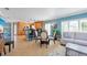 Open living and kitchen area with dining table and sofa at 213 75Th St, Holmes Beach, FL 34217