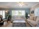 Bright living room with comfy sofas and large windows at 213 75Th St, Holmes Beach, FL 34217