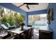 Outdoor patio with seating, pool view, and ceiling fan at 213 75Th St, Holmes Beach, FL 34217