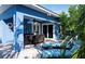 Outdoor patio with seating, dining area, and grill at 213 75Th St, Holmes Beach, FL 34217
