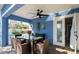Covered patio with dining set and pool access at 213 75Th St, Holmes Beach, FL 34217
