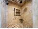 Large walk-in shower with checkered floor and multiple shower heads at 213 75Th St, Holmes Beach, FL 34217