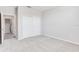 Well-lit bedroom with carpet and double door closet at 23411 Collina Way # 9102, Port Charlotte, FL 33980