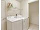 Laundry room with washer, dryer, storage shelf, tile flooring, and white painted walls at 4072 Fairway Pl, North Port, FL 34287