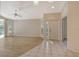 Spacious living room with wood-look flooring, an entryway, and a bright and airy feel at 4072 Fairway Pl, North Port, FL 34287