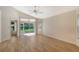 Light-filled main bedroom with sliding doors to the lanai and neutral color palette at 4072 Fairway Pl, North Port, FL 34287
