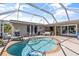 Enclosed kidney-shaped pool with patio furniture at 4108 101St W St, Bradenton, FL 34210