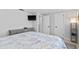 Guest bedroom with gray wood bed frame and coastal decor at 4108 101St W St, Bradenton, FL 34210