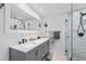 Modern bathroom with double vanity, large shower, and marble tile at 4108 101St W St, Bradenton, FL 34210