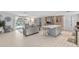 Open kitchen and living area with island and pool view at 4108 101St W St, Bradenton, FL 34210