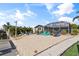 Relaxing sandy backyard with fire pit and dock at 4108 101St W St, Bradenton, FL 34210