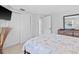 Bright bedroom with sliding doors to hallway at 4108 101St W St, Bradenton, FL 34210