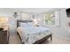 Bedroom with rustic wood bed frame and coastal decor at 4108 101St W St, Bradenton, FL 34210