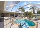 Relaxing kidney-shaped pool with screened enclosure at 4108 101St W St, Bradenton, FL 34210