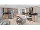 Modern kitchen with stainless steel appliances and a large island with seating at 4108 101St W St, Bradenton, FL 34210