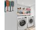 Laundry room with LG washer and dryer, shelving at 4108 101St W St, Bradenton, FL 34210