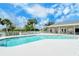 Refreshing community pool with plenty of lounge chairs at 4072 Fairway Pl, North Port, FL 34287