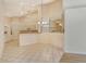Kitchen and dining area with vaulted ceilings and tile flooring at 4072 Fairway Pl, North Port, FL 34287