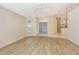 Open living room and kitchen with light flooring throughout at 4072 Fairway Pl, North Port, FL 34287