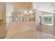 Bright dining area with mirrored wall and chandelier at 4072 Fairway Pl, North Port, FL 34287