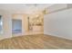 Bright living room with vaulted ceilings and wood-look flooring at 4072 Fairway Pl, North Port, FL 34287