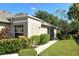 Well-manicured landscaping surrounds this charming house exterior at 4072 Fairway Pl, North Port, FL 34287