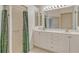 Main bathroom with double vanity and walk-in shower at 4072 Fairway Pl, North Port, FL 34287